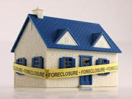 house with foreclosure tape.jpg